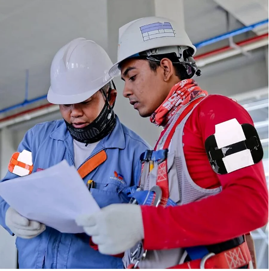 Oil and gas workers reviewing a safety plan